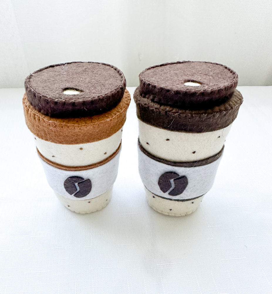 Two felt coffee cups with lids in mocha and latte colours.