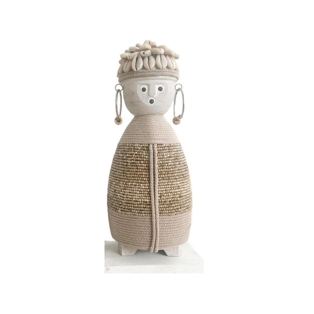 beige doll with macramé body, shell hat and earrings with beads on a wooden stand