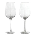 clear wine glasses with an etched white palm tree