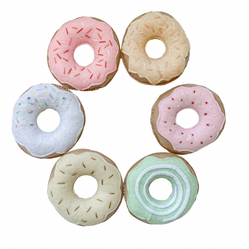Set of six different coloured donuts with freckles