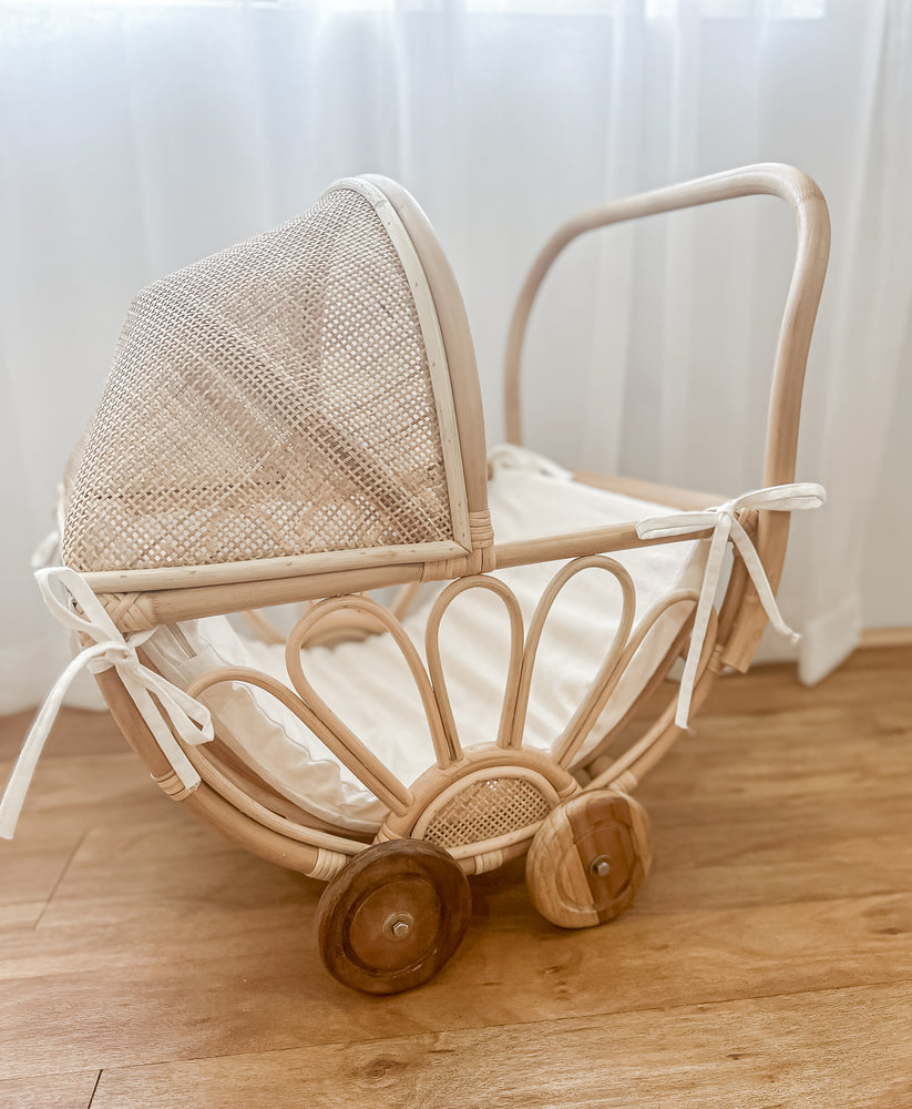 rattan play dolls pram violet side view lifestyle wooden floor handmade australia