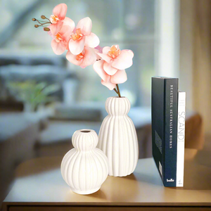 large Harper ceramic vase displayed with contemporary decorative items