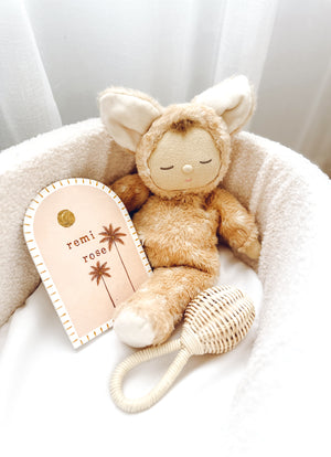 Natural rattan baby rattle Luella showing handcrafted weaving detail - decorative nursery accent with soft chime bell