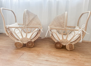 Two handmade rattan play dolls prams including Violet model on wooden floor - premium Balinese artisan children's toys with teak wheels and foam linen inserts for ages 3+