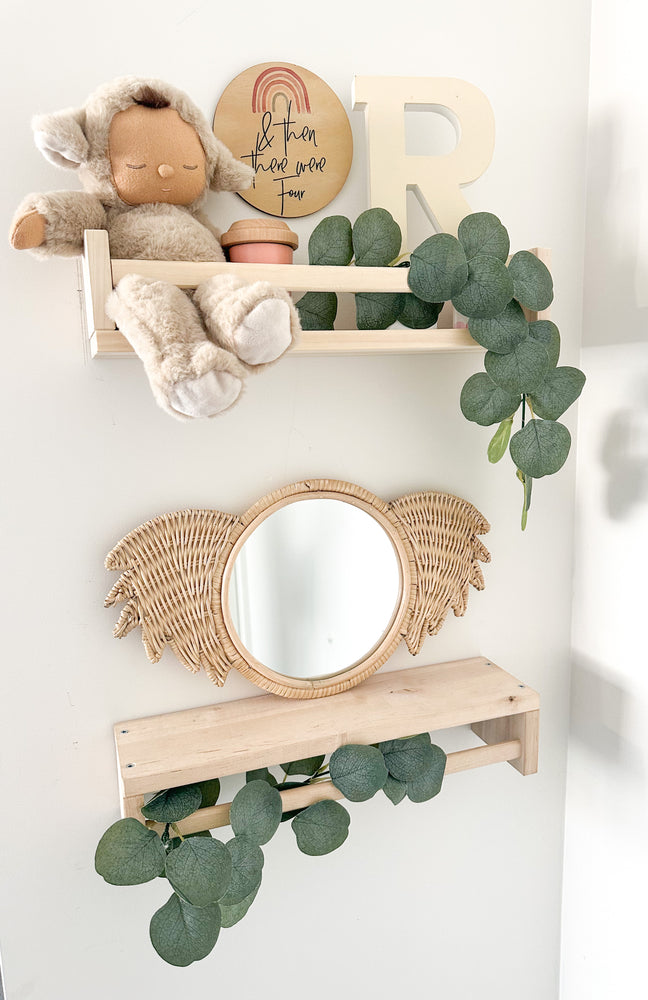 Rattan koala mirror Ralf styled on shelf in children's room with toys - handmade Indonesian nursery decor adding whimsy and character to kids' spaces, wall-mountable or shelf display