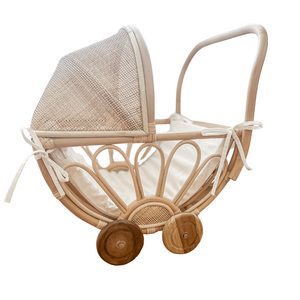 Handmade rattan play dolls pram Violet with foam linen insert - side view on white background, featuring teak wooden wheels and Balinese artisan craftsmanship for children 3+
