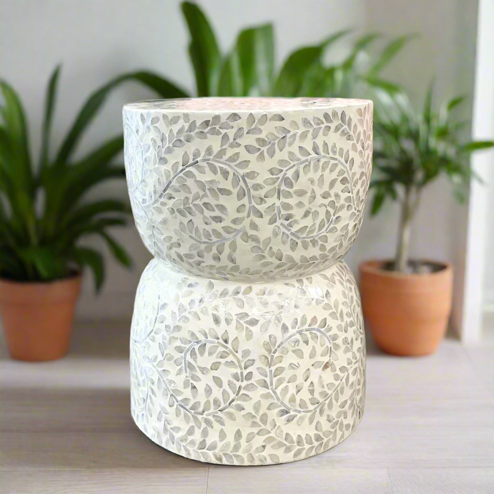 Shell inlay stool Gigi styled in living room with green pot plants - versatile decorative side table for home decor