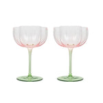 Pink tulip shaped top and green stemmed wine glasses
