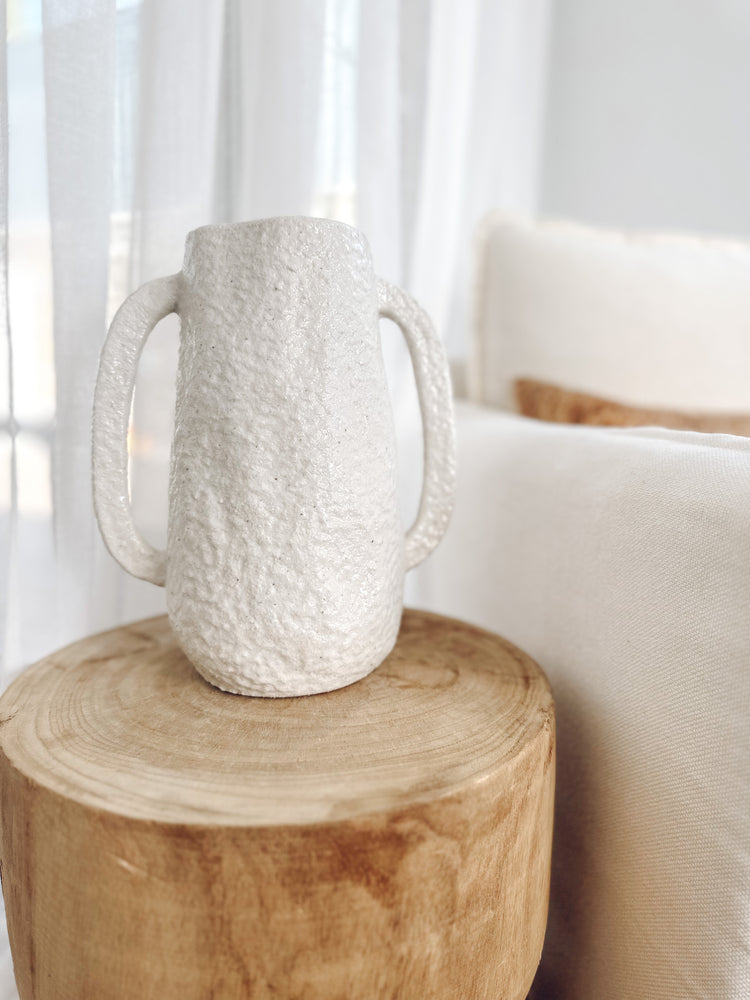Dune large tuscan  vase displayed on top of wooden stool with background window sheers