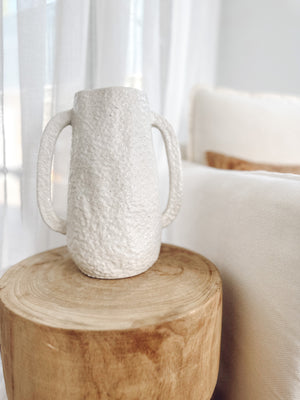Dune large tuscan  vase displayed on top of wooden stool with background window sheers