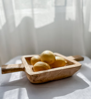 Wooden dough bowl Elena with lemons in natural light - rustic charm bowl perfect for coastal and bohemian home styling