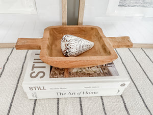 Wooden dough bowl Elena with shell on books showing natural wood grain - elongated basin design for dining table centrepiece