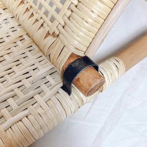 metal support on handwoven, lightweight, natural rattan beach chair 