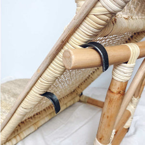 metal supports on handwoven, lightweight, natural rattan beach chair 