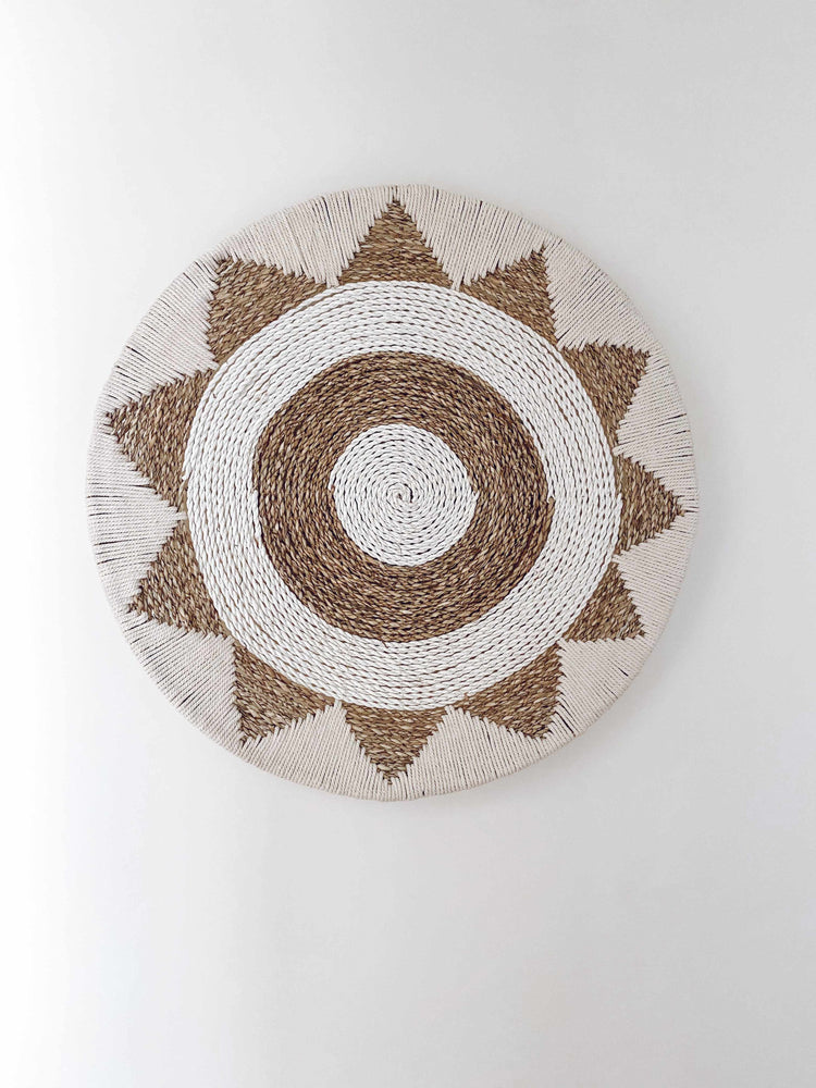cotton raffia and macrame wall hanging in an aztec pattern