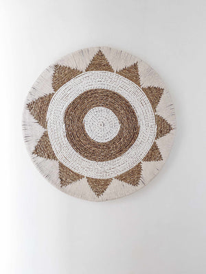 cotton raffia and macrame wall hanging in an aztec pattern
