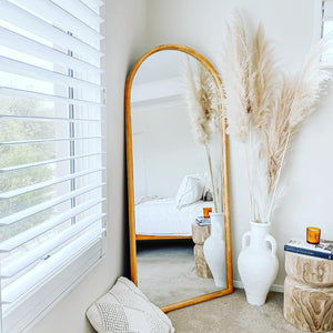 full length oak coastal mirror in bedroom setting
