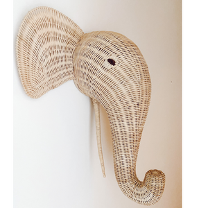 Rattan elephant hanging on wall