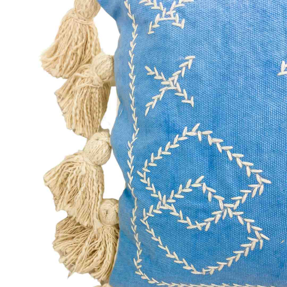 close up of pattern on lumber cushion cover with tassels