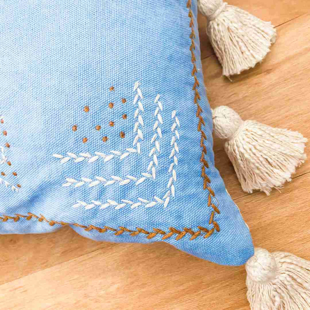 Apollo cushion cover hand-sewn pattern detail - intricate cotton texture by skilled Indian artisans with tassel accents