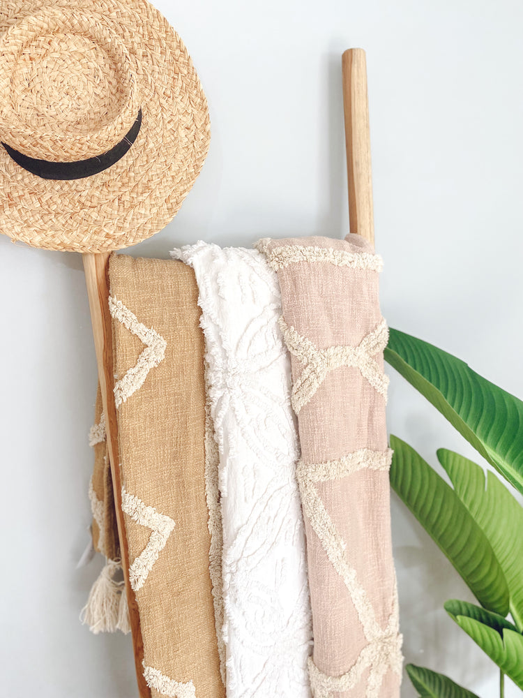 Darcie cotton throws beautifully styled on wooden ladder for bedroom and living room interior design inspiration