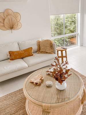 lumbar cushion with tassels on lounge chair