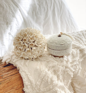 Beaded box displayed with frangipani shell