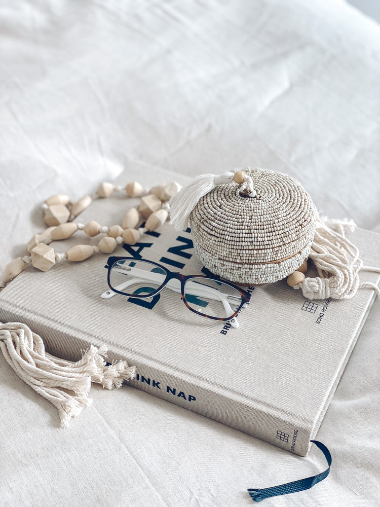 Beaded box displayed on top of book