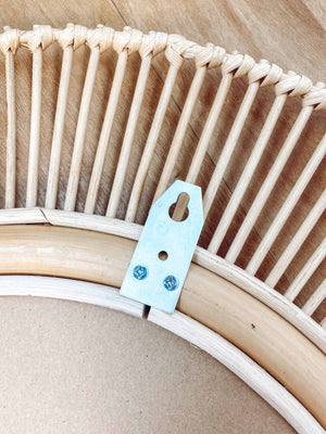 Kaelin rattan mirror back view showing sturdy metal wall hook for easy installation and secure mounting