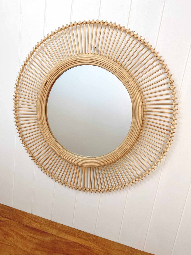 Kaelin rattan wall mirror hanging in modern entryway creating focal point, showcasing 60cm size and artisanal craftsmanship
