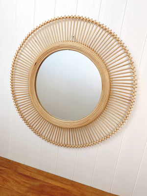 Kaelin rattan wall mirror hanging in modern entryway creating focal point, showcasing 60cm size and artisanal craftsmanship